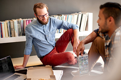 Buy stock photo Men, students and studying with food for group project, assignment or assessment at home. Male people, friends or creative junior designers with pizza or takeout for meal, chat or homework at house