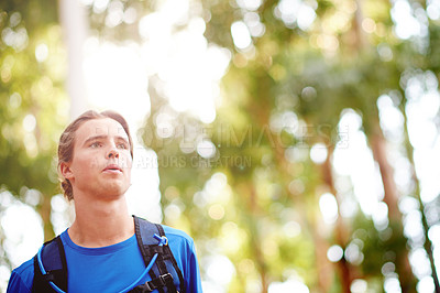 Buy stock photo Nature, man and exercise with running for fitness, breathing and runner with training for marathon. Outdoor, male person and athlete with drinking tube for wellness, endurance and cardio for workout