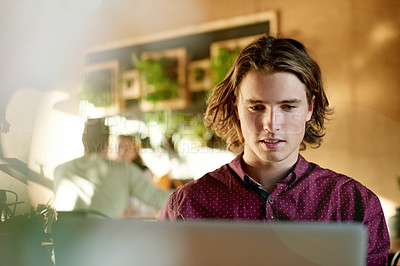 Buy stock photo Laptop, student and man in coffee shop for remote learning, research or check curriculum on internet. Computer, cafe and online education with scholarship, review thesis and quiz for college course