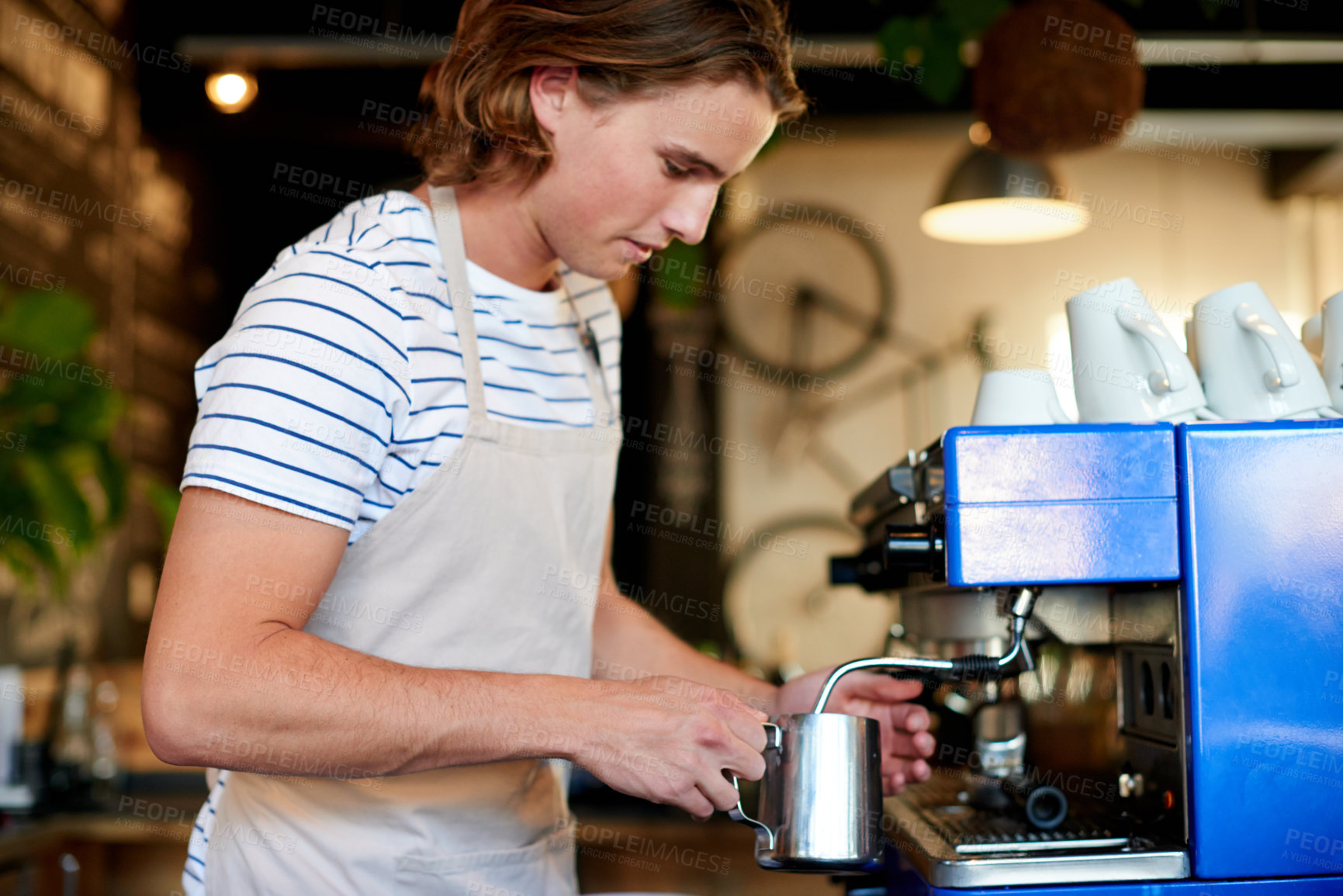 Buy stock photo Barista, steam milk and man with machine in coffee shop for drink making, process and service. Cafe, employee and professional with brewing, appliance and espresso or latte for small business