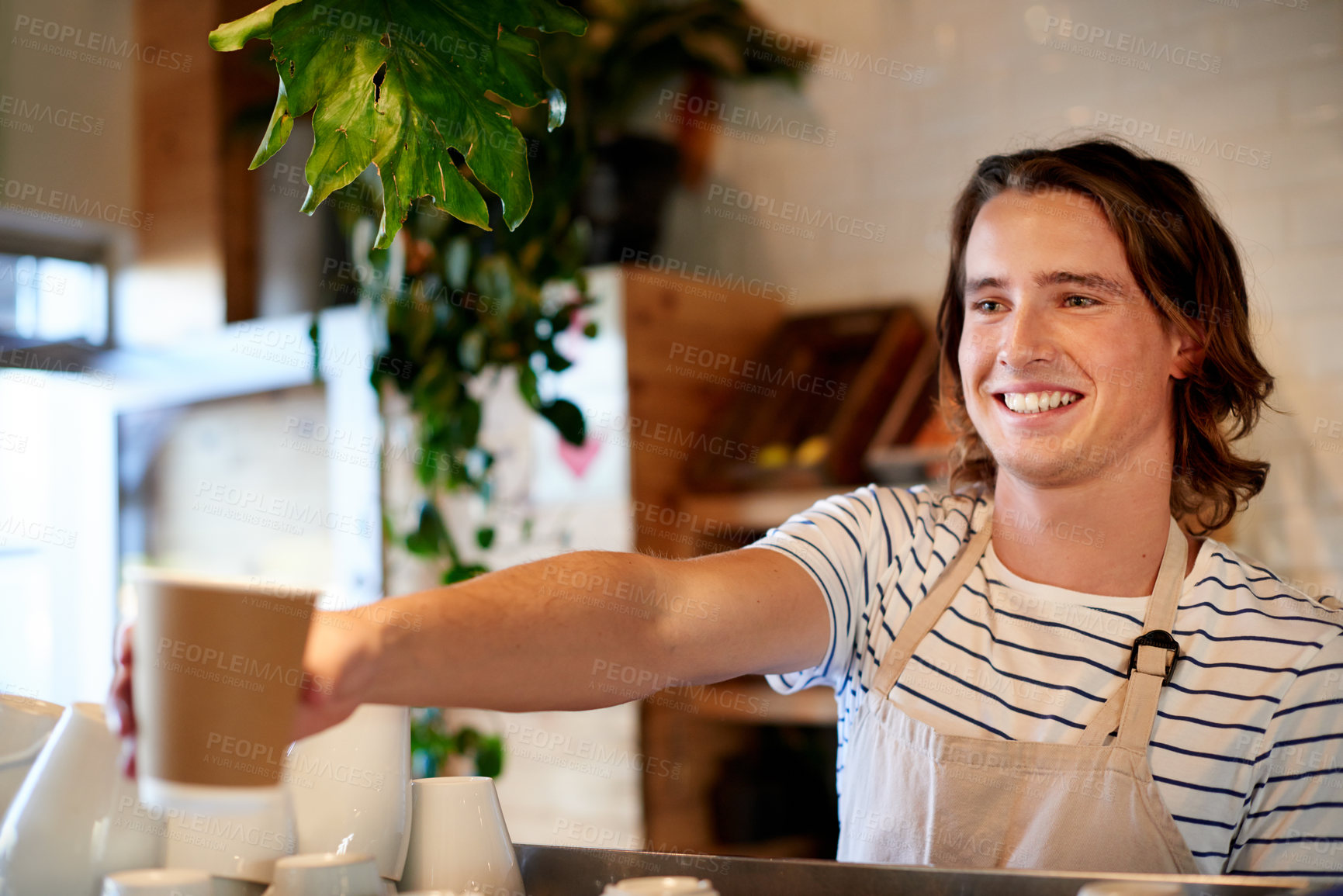Buy stock photo Happy man, barista and giving tea at cafe, beverage and sale with customer experience at restaurant for drink. Person, waiter and order with service for latte, cappuccino or smile at coffee shop