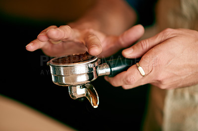 Buy stock photo Coffee, cafe and hands of person with machine with ground beans for cappuccino, latte and espresso. Restaurant, closeup and barista with portafilter for fresh brew, caffeine beverage and drink