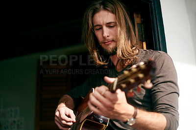 Buy stock photo Music, guitar and song with man in home for performance, band practice and production. Musician, acoustic instrument and creative artist with person in apartment for sound, guitarist or entertainment