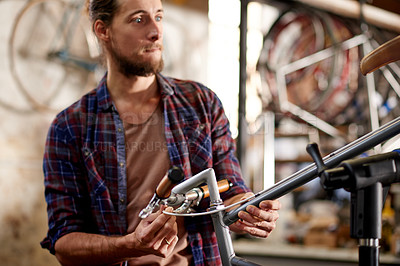 Buy stock photo Serious, technician and man with bicycle, shop and inspection of handlebars, repair and maintenance. Fixing, bike and person with ideas for service, mechanic and entrepreneur in workshop or handyman