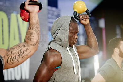 Buy stock photo Gym, group fitness and kettlebell for workout, power and sports challenge for muscle. People, bodybuilder and heavy weights for training with health club, exercise class and personal trainer athlete
