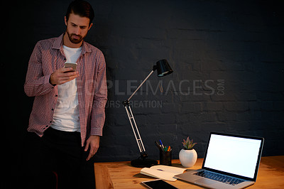 Buy stock photo Laptop screen, night and phone with designer man in studio for communication or social media. App, computer and mockup on display with employee at dark workplace for graphic design in evening