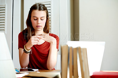 Buy stock photo Girl, thinking and student with anxiety in home for exam pressure, stress or fidget with ring. Nervous teenager, reflection and person with worry, stimming and overwhelmed with test fail in house
