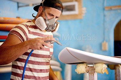 Buy stock photo Spray, man and surfboard in workshop for restoration, project tools or manufacturing. Artistic production, paint or creative wooden craft in small business for surfing equipment or renovation process