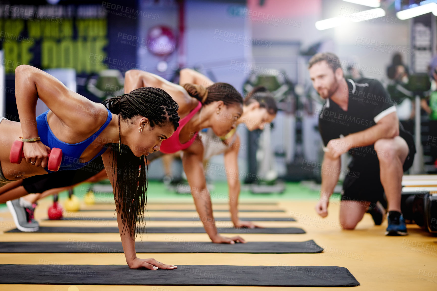 Buy stock photo Workout, women and dumbbell in gym class for weightlifting, arm muscle development or exercise group. Bodybuilder, fitness and personal trainer with weight for strength, commitment or sport activity