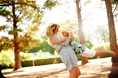 Buy stock photo Smile, mother and spinning child at park for fun, playful games and bonding together on holiday. Happy, woman and swinging kid with energy, activity and coordination with balance for vacation outdoor
