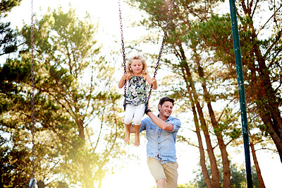 Buy stock photo Happy man, playground and child at park with swing in air, bonding and sunlight for fun childhood memories. Smile, nature and daughter outdoor with father, laugh together and playing for connection.