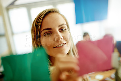 Buy stock photo Businesswoman, glass or writing on sticky note for planning, organizing or brainstorming for campaign. Creative, project management or person in office with smile, idea and startup timeline.