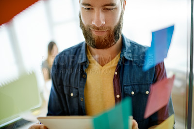 Buy stock photo Thinking, tablet and business man by glass with sticky notes for brainstorming, online project and planning. Creative office, startup and workers on digital tech for research, task agenda and website