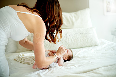 Buy stock photo Baby, mother and change diaper on bed for care, hygiene and cleaning in home together. Mom, infant and child with nappy in bedroom with parent for health, morning routine and dressing with family