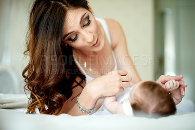Buy stock photo Bed, love or development with baby and mother in home together for bonding, cuddling or growth. Maternity, security and smile of woman parent with infant child in bedroom of apartment for connection