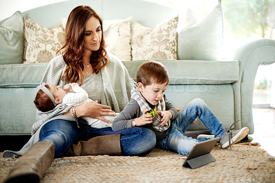 Buy stock photo Mom, baby and son with tablet in home with subscription, online video and relax. Parent, child and mother on floor in living room with internet, streaming cartoon or app for entertainment or growth