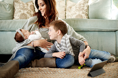 Buy stock photo Mother, baby and children with tablet in living room for relax, bonding and development. Parent, son and mom on floor in home with smile, relationship and together for entertainment or growth