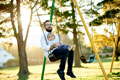 Buy stock photo Playground, happy and dad with child on swing for fun, adventure and playing together on weekend morning. Family, nature and father with girl at park for bonding, relationship and connection outdoor