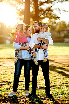 Buy stock photo Parents, family and girls in park, talking and bonding together with happiness, nature and break. Outdoor, mother and father with kids, development and playing with daughters, holiday and discussion