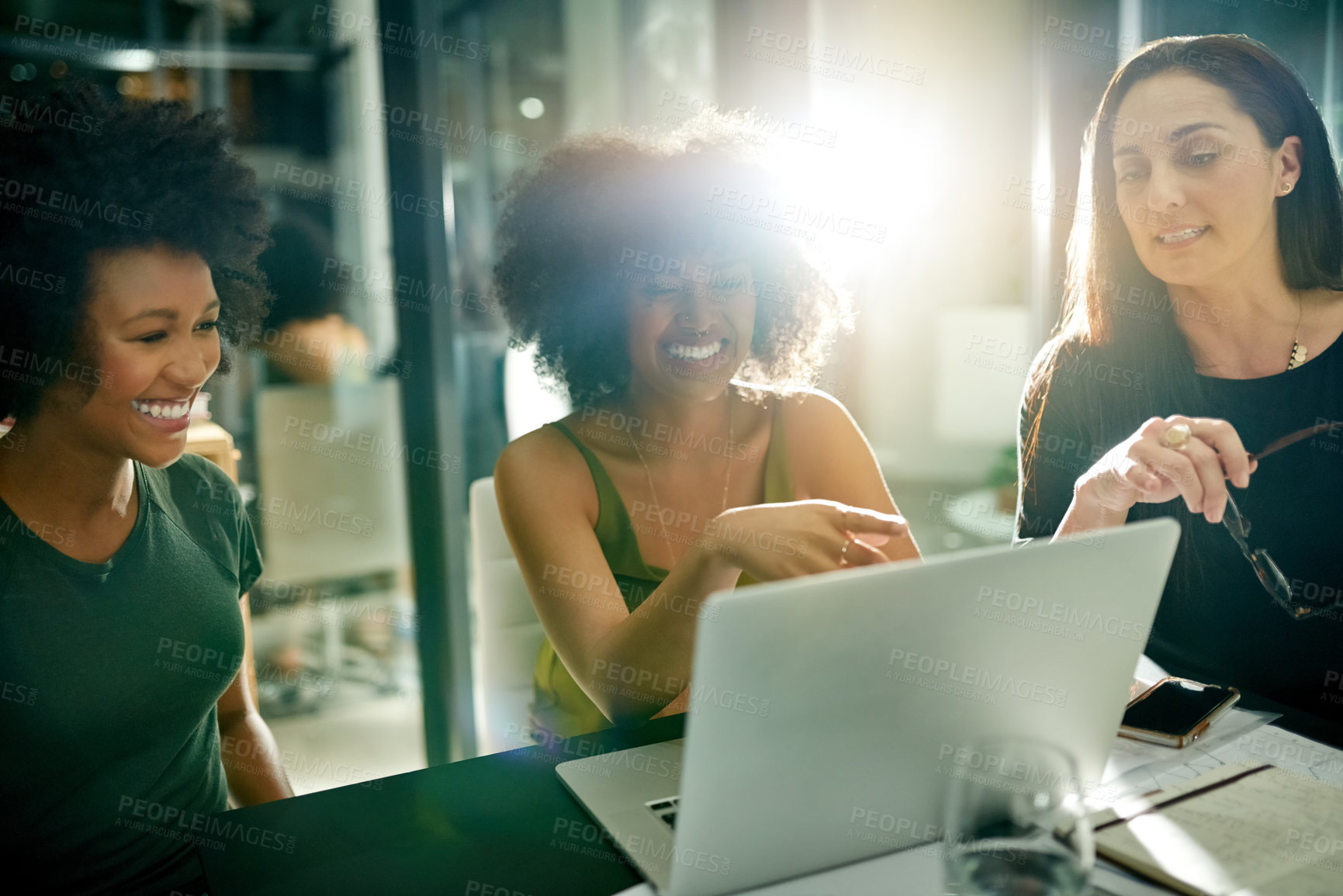 Buy stock photo Happy woman, team and laptop at office, night and discussion with review, insight and point at company. People, designer and group with computer, documents or feedback with profit at creative agency