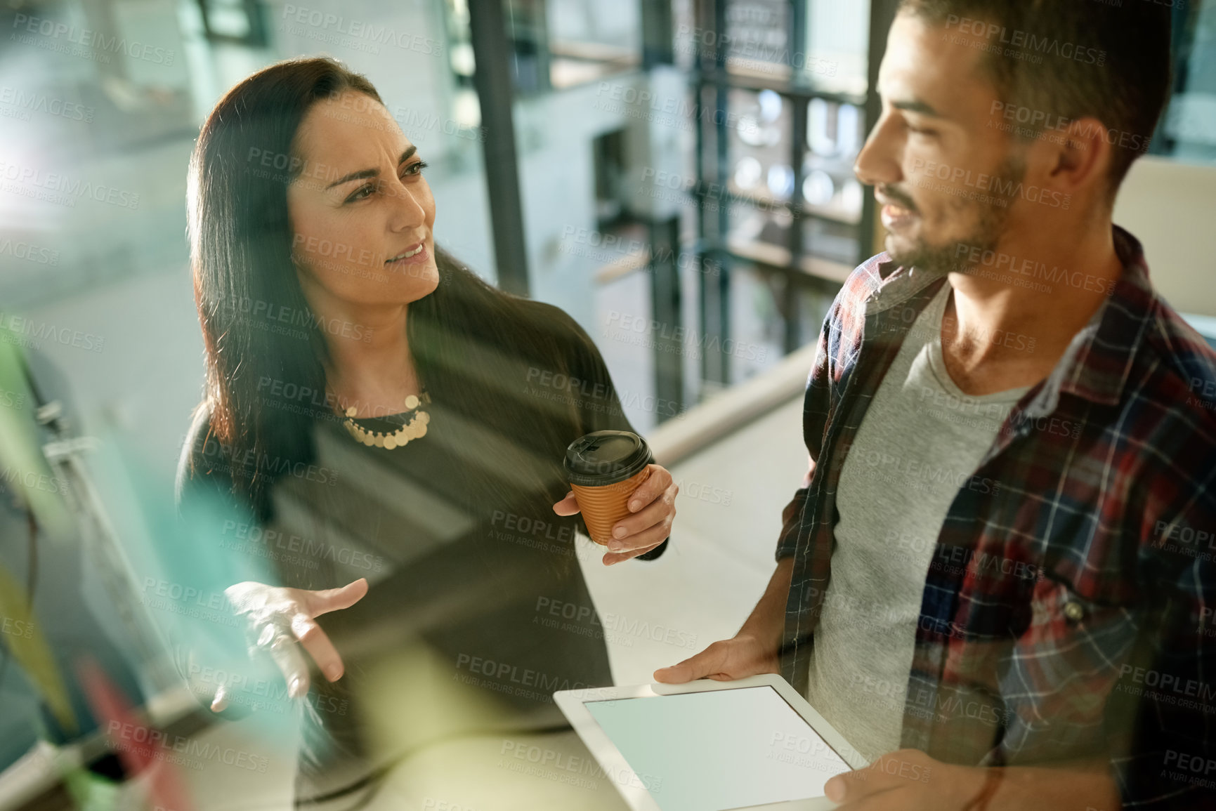Buy stock photo Man, woman and tablet at glass wall, startup and planning with smile for brainstorming at media company. Black people, team and tech at office with app, review or blank screen at creative agency