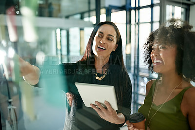 Buy stock photo Team, business women and planning on glass wall in office for brainstorming event themes or idea. Meeting, tablet or collaboration for project agenda with strategy for schedule, coordination or laugh