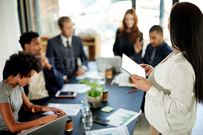 Buy stock photo Speaker, presentation and tablet with business woman in office for stakeholder, project proposal and planning. Teamwork, research and collaboration with employees in agency for profit report