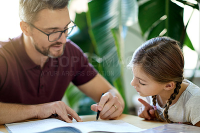 Buy stock photo Help, education and dad with kid for homework in house for learning, studying or project. Read, teaching and father with girl child student for working on academic assignment together in apartment.