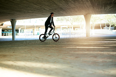 Buy stock photo Man, rider or cycling with bicycle in urban park for extreme sport, balance or carbon footprint. Male person, cyclist or professional biker with space for outdoor challenge or free style riding