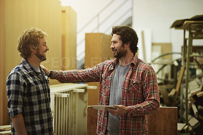 Buy stock photo Artisan, team and happy people with tablet in workshop for manufacturing, carpentry or production. Small business, talk or carpenter with woodwork project in factory together for engineering trade