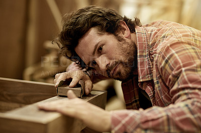 Buy stock photo Carpenter, woodworking and man sanding in studio for repair, renovation or restoration. Production, manufacturing and carpentry trade with labor, lumber and project in workshop for furniture craft