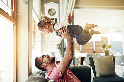 Buy stock photo Airplane, support and father with daughter on sofa for flying games, bonding and love. Happiness, connection and balance with man and child in living room of family home for trust, growth and care