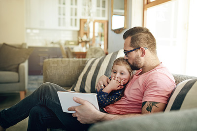 Buy stock photo Man, kiss and child on couch with tablet, bonding and care for animation video. Trust, father and daughter in home with technology, digital app and connection for special family memory in living room