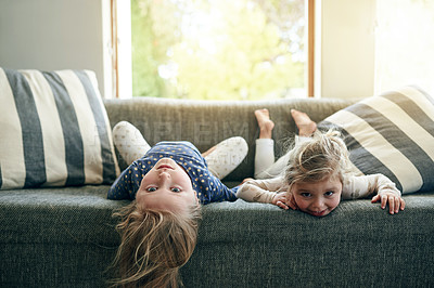 Buy stock photo Portrait, sisters and children on sofa, lounge or siblings with smile on break, bonding or together. Happy, girls and relax on couch, home and kids in living room, chill and family in apartment