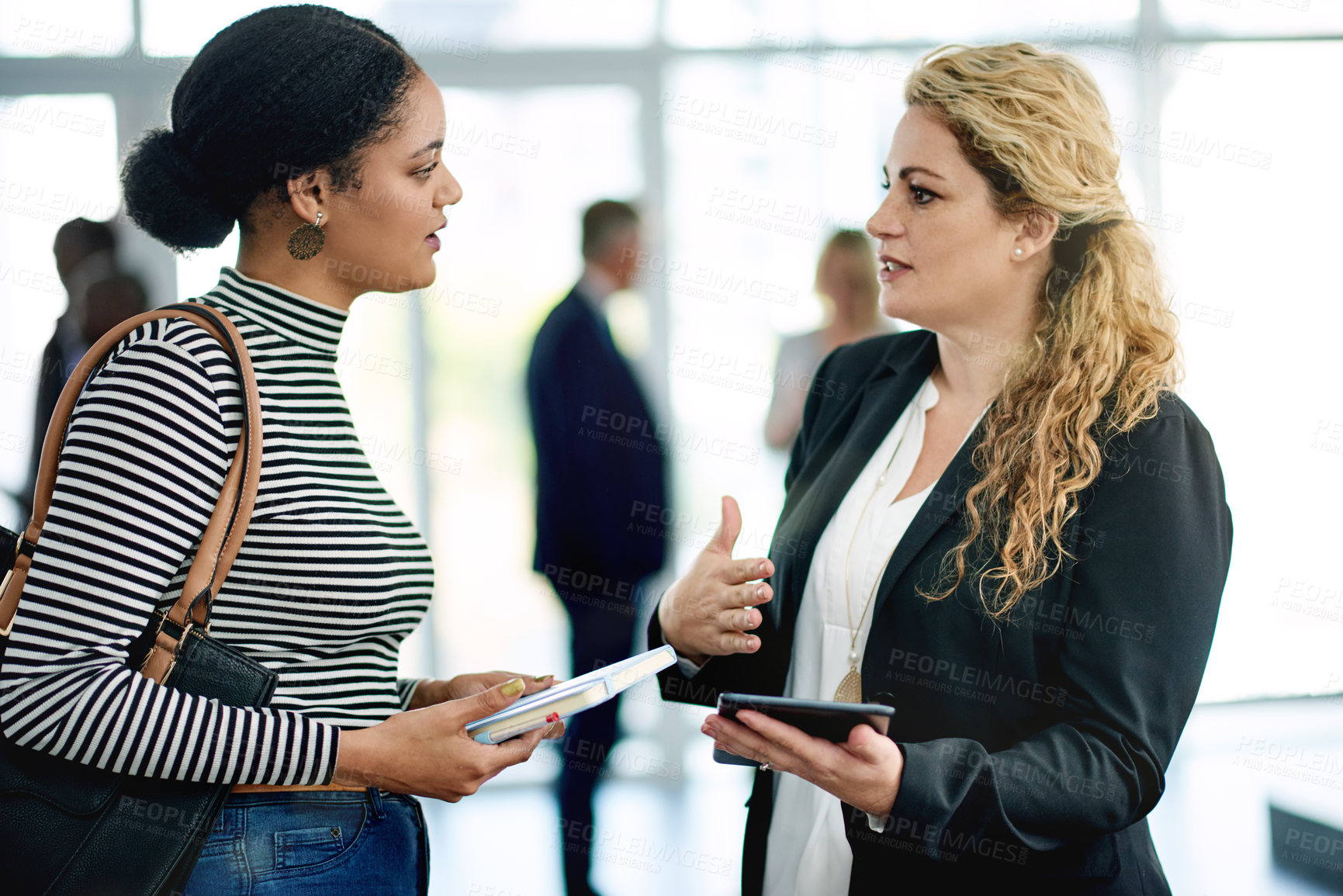 Buy stock photo Team, workshop and tablet with business people at conference for tradeshow host, help and schedule. Convention guide, online agenda and event assistant with women or employees at seminar for meeting