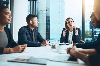 Buy stock photo Business, woman and talking with group in boardroom, meeting and proposal briefing with attention. Collaboration, team leader and explain with listening, strategy and discussion for project in office