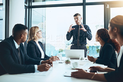 Buy stock photo Businessman, group and meeting with presentation in boardroom, speech and laptop with attention. Collaboration, team leader and explain with listening, strategy and discussion for project in office