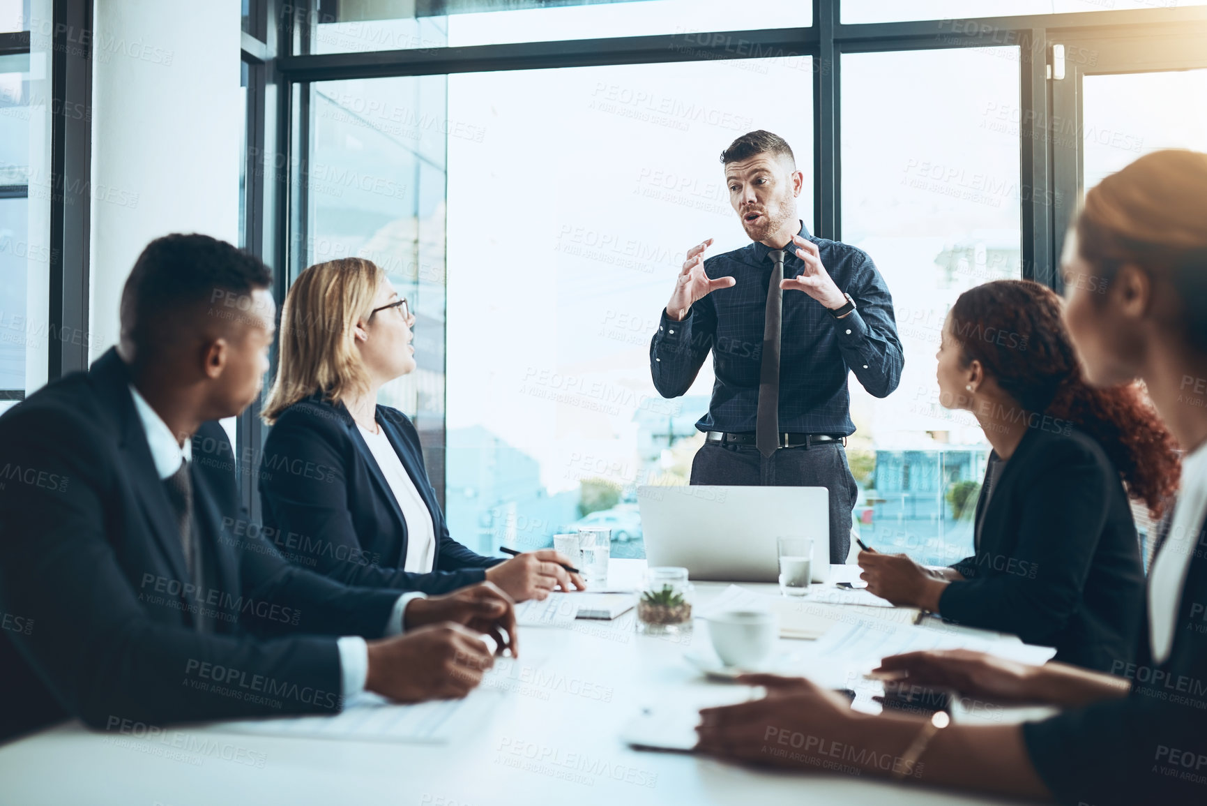 Buy stock photo Businessman, group and meeting with presentation in boardroom, speech and laptop with attention. Collaboration, team leader and explain with listening, strategy and discussion for project in office