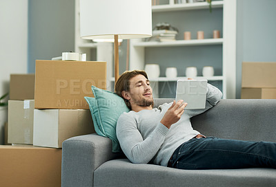 Buy stock photo Moving, research and man with tablet, home or online for renovation of apartment, relax and website. Relocation, boxes and person with tech for house improvement, browsing or info for interior design