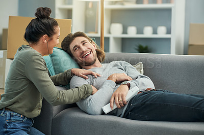 Buy stock photo Couple, talking and relax with watching TV in new home for weekend break, bonding and movie review. Love, people and laugh on sofa for funny series, streaming subscription and support in living room