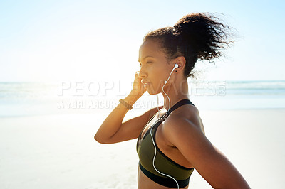 Buy stock photo Fitness, exercise and woman with earphones at beach for music, audio or workout podcast. Thinking, runner and athlete with space for marathon training, flare and prepare or getting ready by ocean