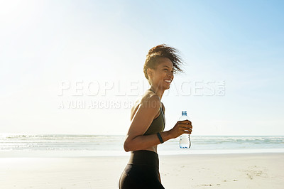 Buy stock photo Sea, fitness and happy woman with water bottle for health, wellness and break. Hydration, smile and thirsty runner at beach with liquid for nutrition, sports and thinking of exercise with space