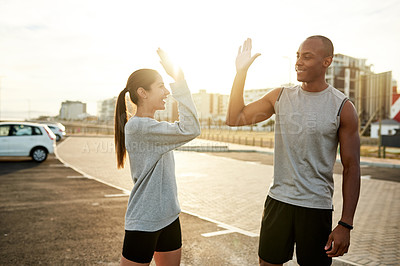 Buy stock photo High five, man and woman in city for training, wellness and endurance exercise. Athlete, interracial couple and fitness challenge for workout, physical health and resilience or cardio together