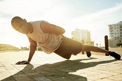 Buy stock photo Man, exercise and one arm pushup in city for fitness, workout or body weight training for health. Portrait, calisthenics and African athlete with strong muscle, sports or balance with core stability