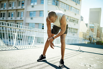 Buy stock photo Fitness, athlete and man in city, tired and done with workout routine, break and practice for sport. Outdoor, runner and person with fatigue, wellness or sportswear for exercise, rest and training