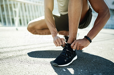 Buy stock photo Person, hands and tie with shoes for fitness, workout preparation or exercise on asphalt in city. Active, runner and getting ready with sneakers or tying for balance, safety or health and wellness