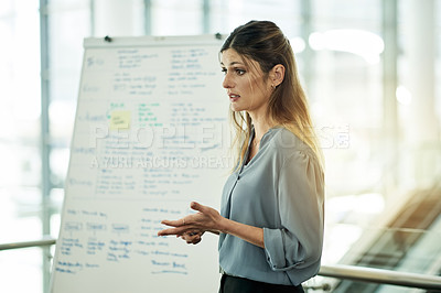 Buy stock photo Whiteboard, presentation and speaker with business woman in office for teaching, timeline or project progress. Pitch, planning and schedule feedback with employee in agency for brainstorming proposal