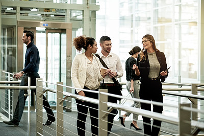 Buy stock photo Walking, team and smile with business people in hotel for meeting, conference expo and partnership. Discussion, collaboration and seminar event with employees on bridge of convention center for trip