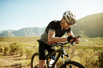 Buy stock photo Phone, travel and bike with man in nature for location app, cycling route and social media post. Speed performance tracking, contact and bicycle with person outdoor for reading and direction search