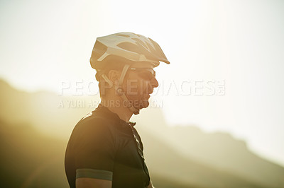 Buy stock photo Man, sunrise and cycling outdoor with helmet for safety, fitness or training by mockup space and thinking. Person, cyclist and headgear for protection in nature, reflection and prepare for triathlon